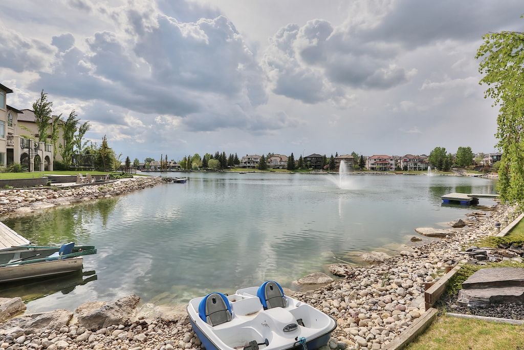 Arbour Lake community lake in northwest Calgary with homes along the waterfront
