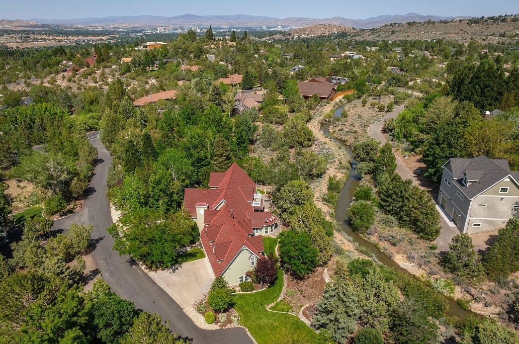A true Victorian-inspired, custom-built home in the coveted neighborhood between Caughlin Ranch and Juniper Ridge.