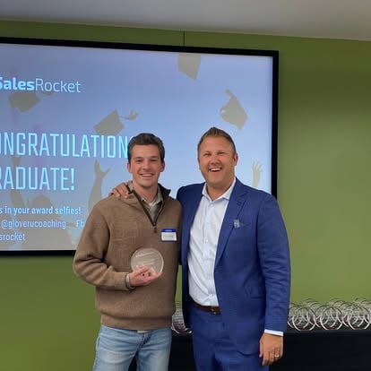 Aaron receiving a SalesRocket award