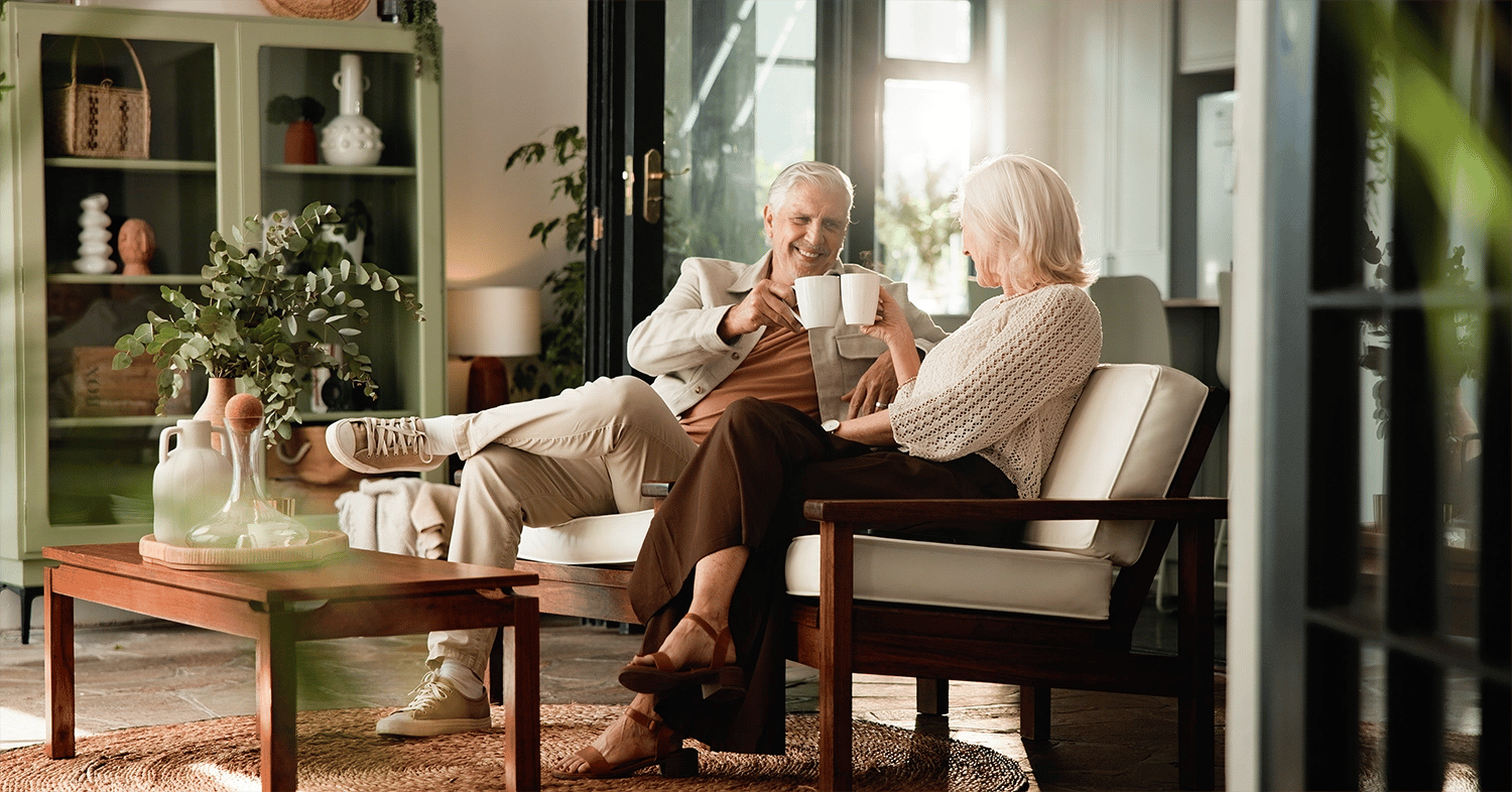happy mature couple on couch