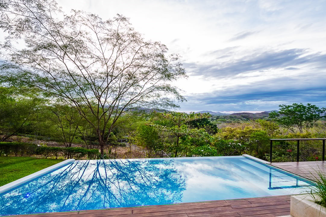 Casa Kalachuchi | Gorgeous Modern Jungle Oasis with Sunset Views in Gated Community