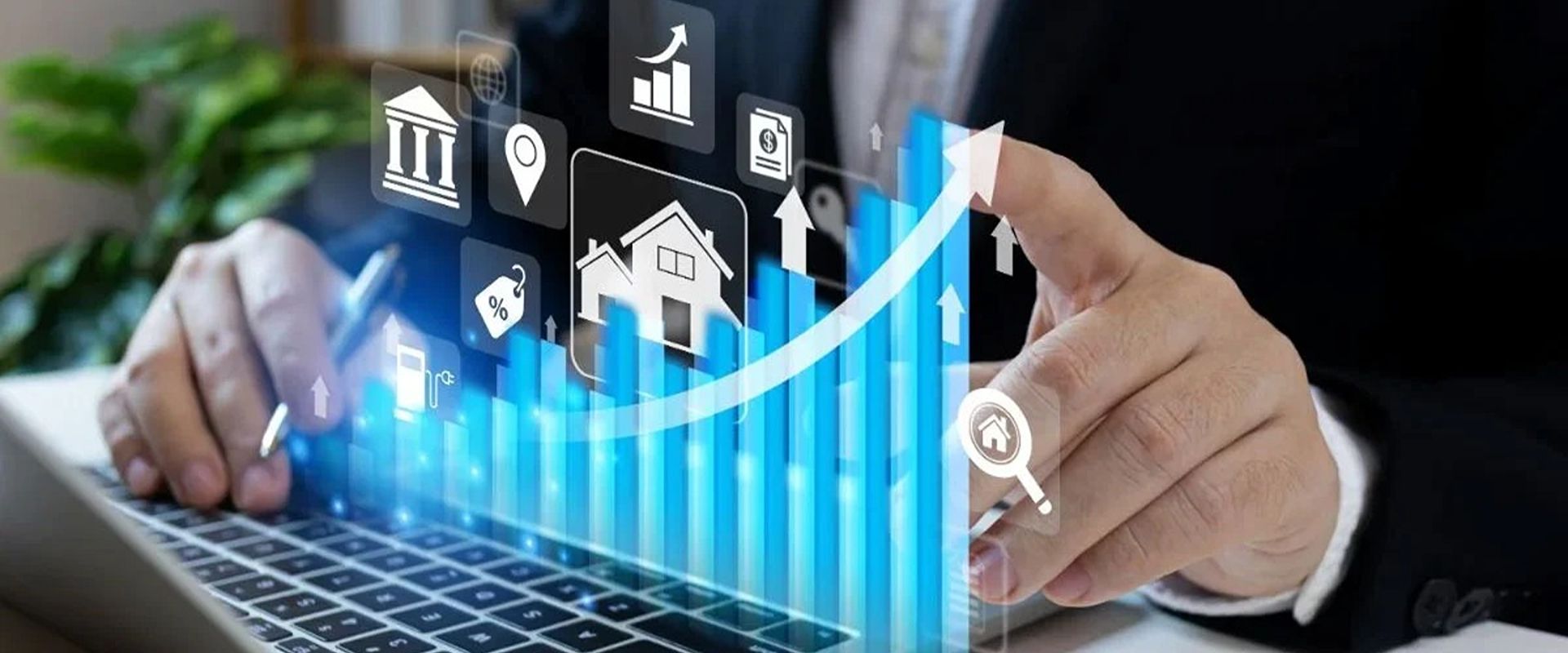 Laptop with rising real estate investment charts and property icons