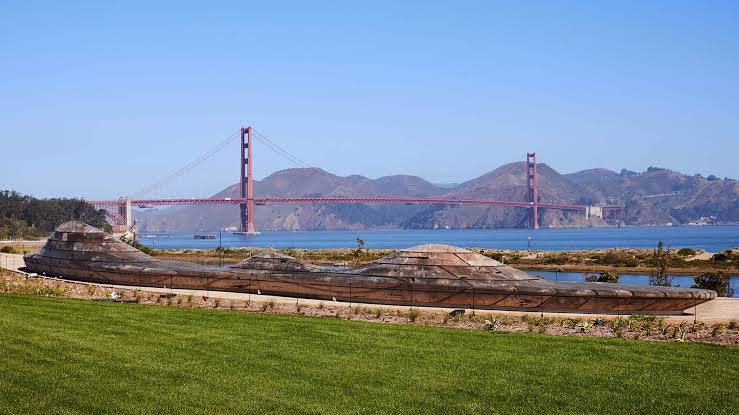 Golden Gate Bridge viewed across San Francisco Bay from green park lawn