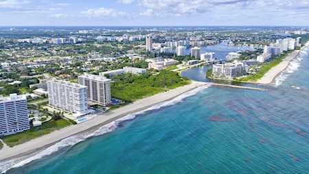 Aerial view of East Boca Raton beachfront high-rises along turquoise Atlantic water.