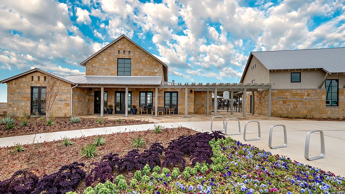 Phillips Creek Ranch community amenity center with manicured landscaping in Frisco TX, offering resort-style living for families in North DFW.