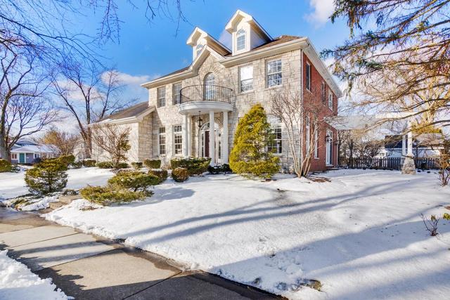 You'll treasure the space and style of this classic Hinsdale home