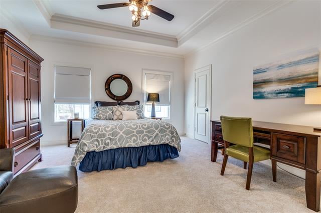 Bedroom with a patterned bed, dark wood armoire, and desk beneath coastal artwork.
