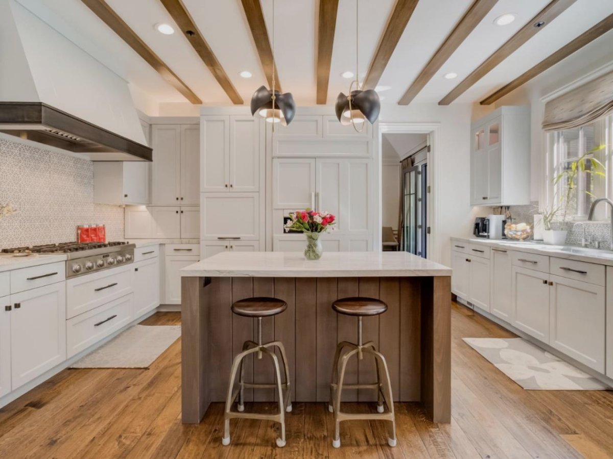 Modern white kitchen at 120 Royal Oaks Court, Menlo Park, California, with wood island and exposed ceiling beams.