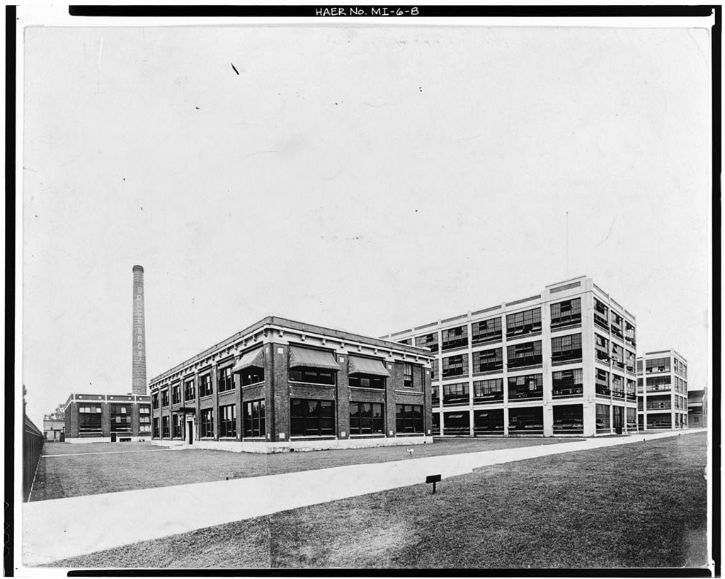 Dodge Brothers factory buildings and smokestack, photographed in black and white.