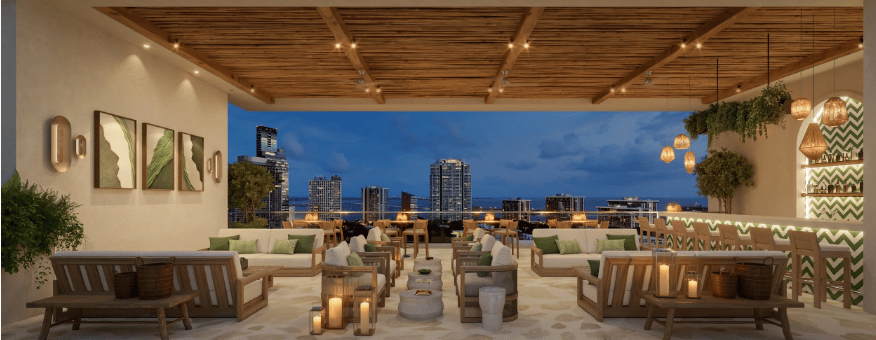 Rooftop terrace lounge with wood ceiling, outdoor seating, and a Miami skyline at dusk.