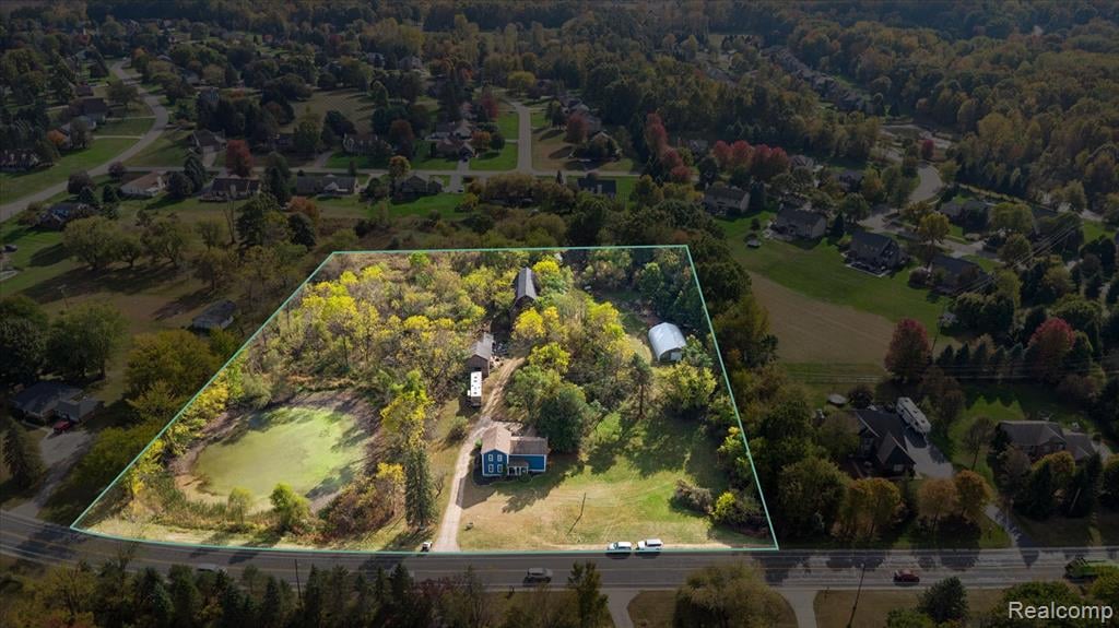 Aerial View 4-bedroom  home for sale at 13278 9 Mile Road, South Lyon, MI, listed by SK Group