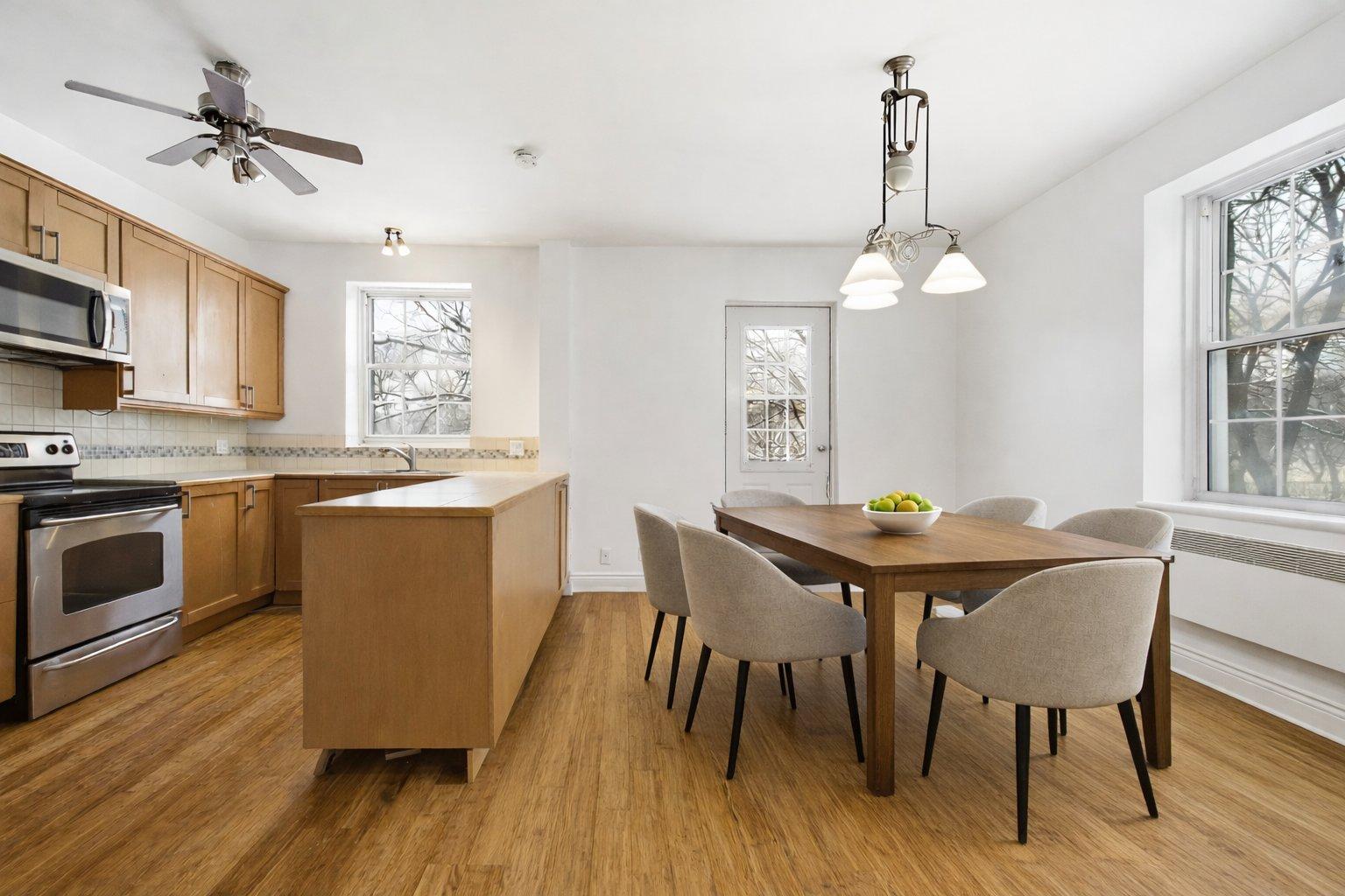 At the edge of Westmount | Corner unit with a view of Mount Royal