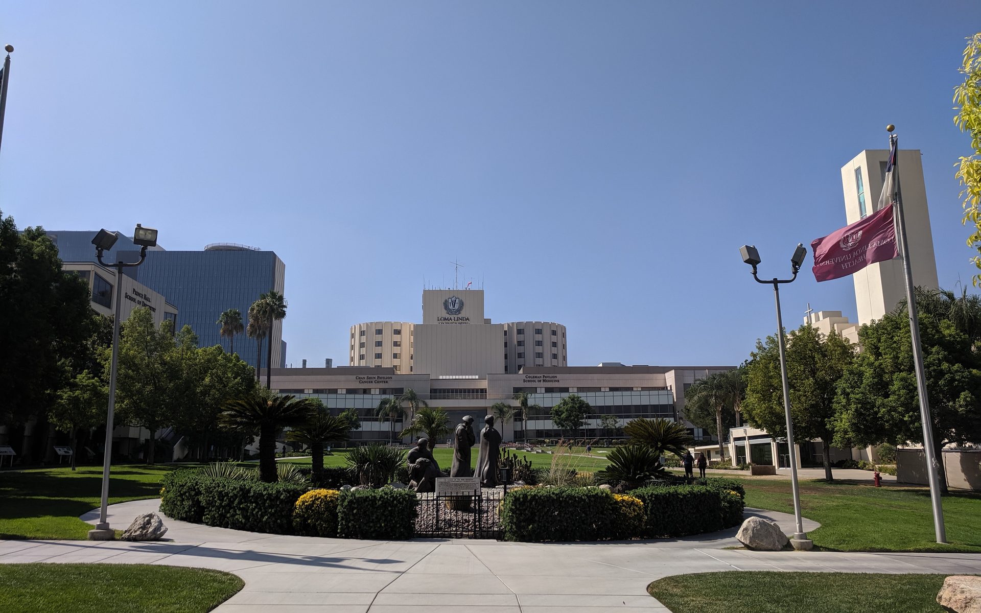 Loma Linda University campus walkway with the medical center behind it, photographed in 2019