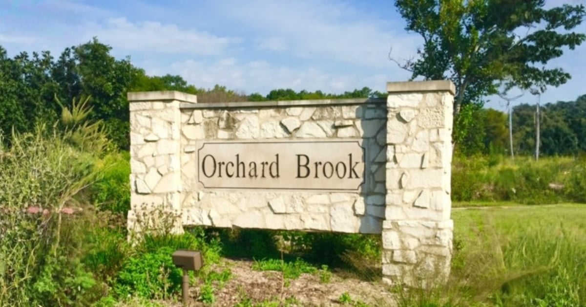 Stone entrance monument sign for Orchard Brook subdivision in Downers Grove IL