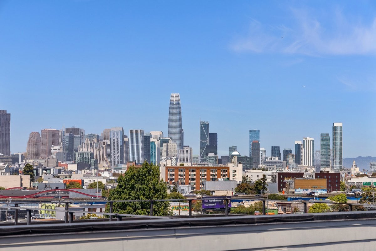 San Francisco skyline with Salesforce Tower rising above downtown buildings.