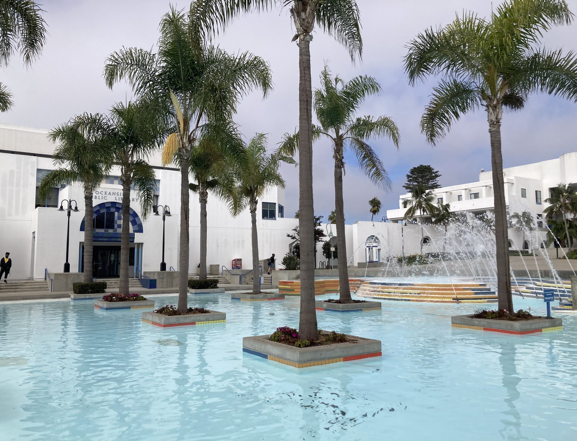 Fountain plaza and palms outside the Oceanside Public Library at the Civic Center on Mission Avenue, October 2024