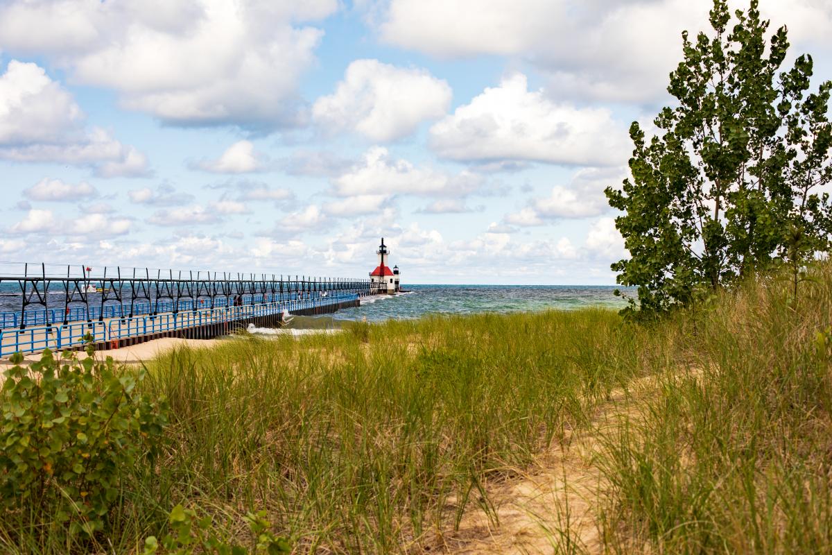 Tiscornia Park Lighthouse in St Joseph, Michigan viewed from the sandy dunes along Lake Michigan.