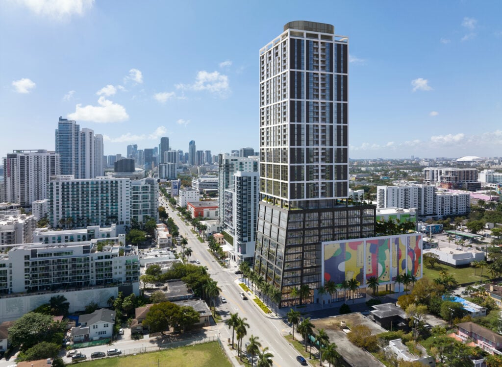 Neo Edgewater tower above Miami buildings, with a colorful mural across its lower facade.