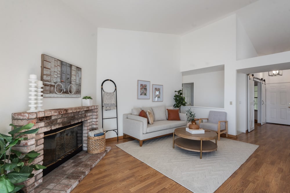 Living room with brick fireplace in single-level Petaluma home