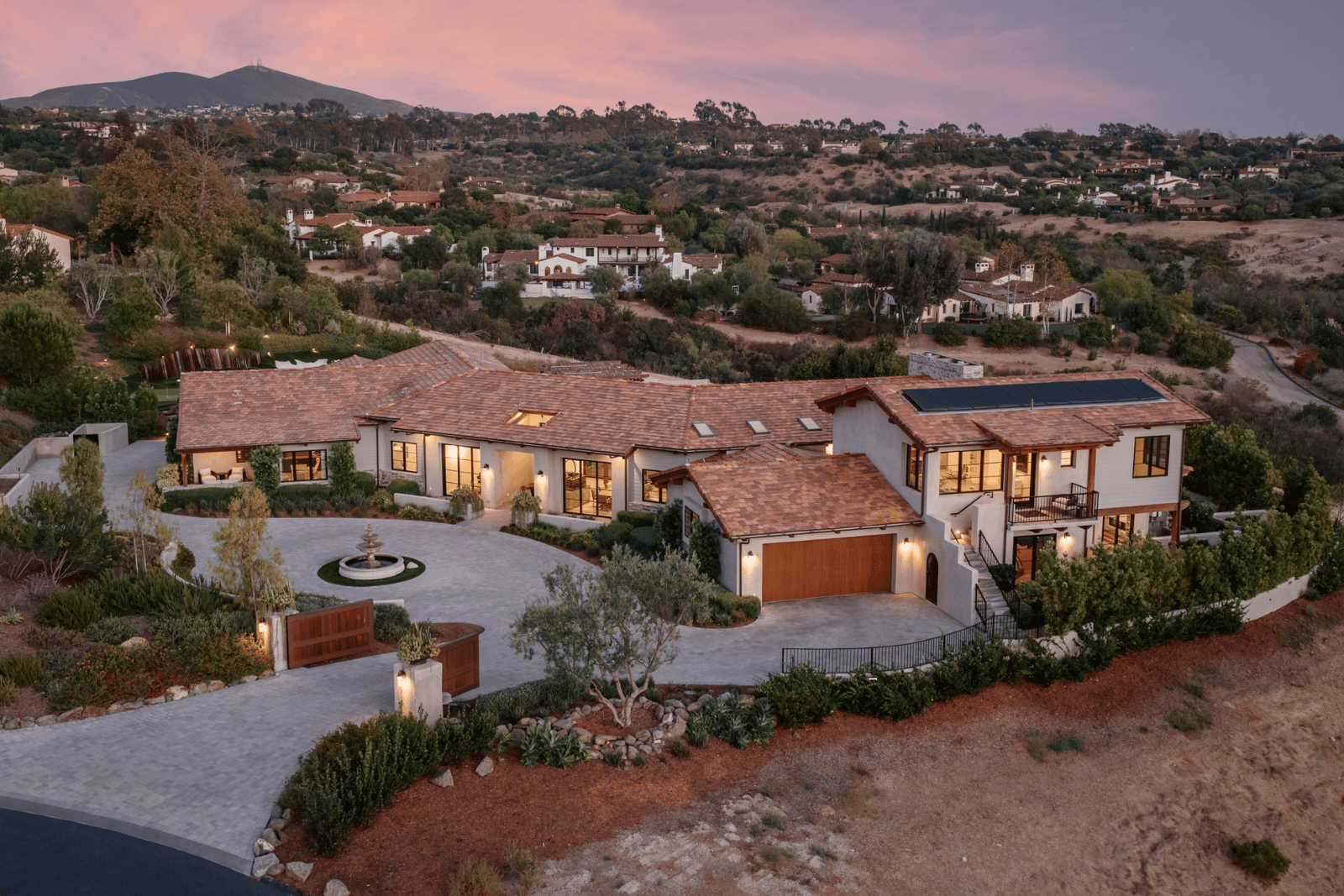 Aerial view of 7555 Northern Lights, a single-level estate in Santaluz, at sunset