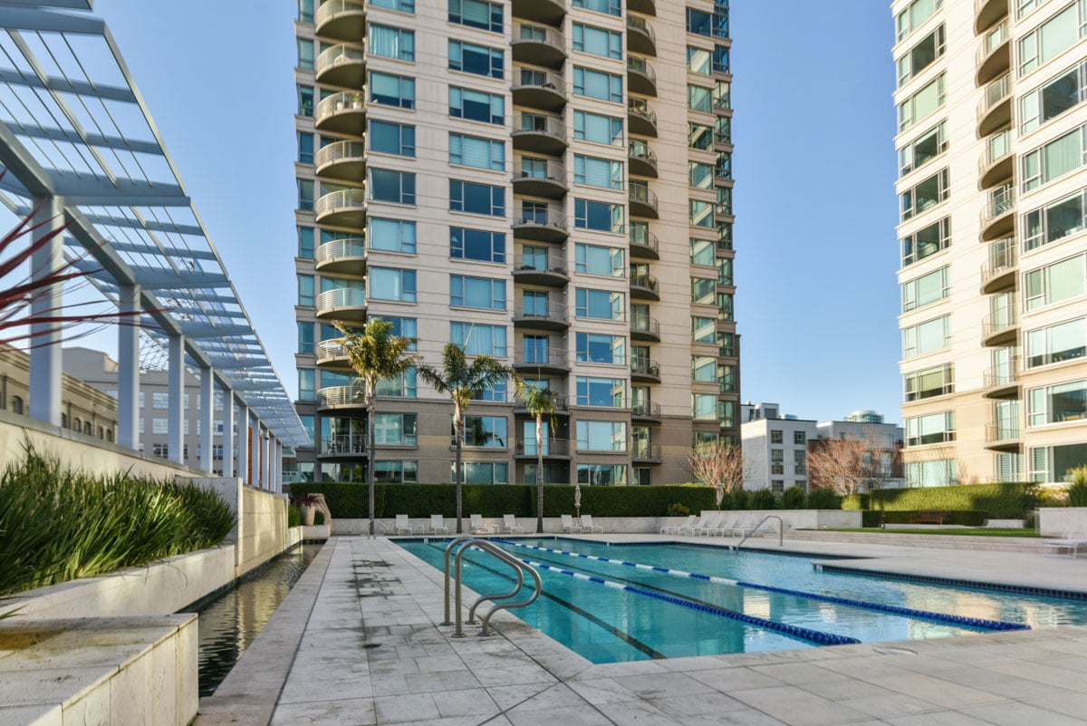 Exterior view of condo community highlighting HOA costs and upkeep