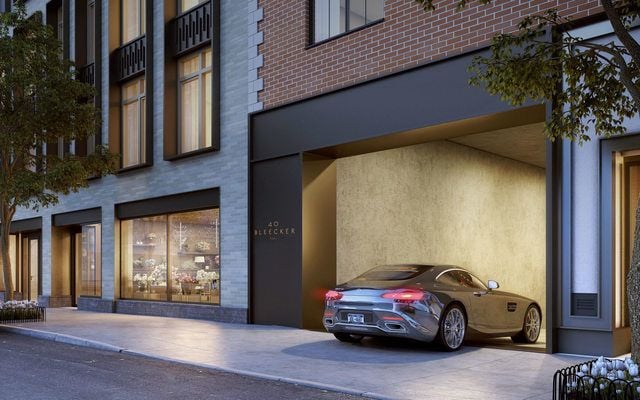 Car pulling into modern well maintained garage entry