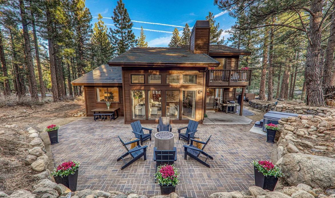 Welcome to this meticulously maintained three bedroom home in Galena Forest Estates. This home offers a perfect blend of comfort and style with over 2,000 square feet of modern elegance on over half an acre of towering pine trees.