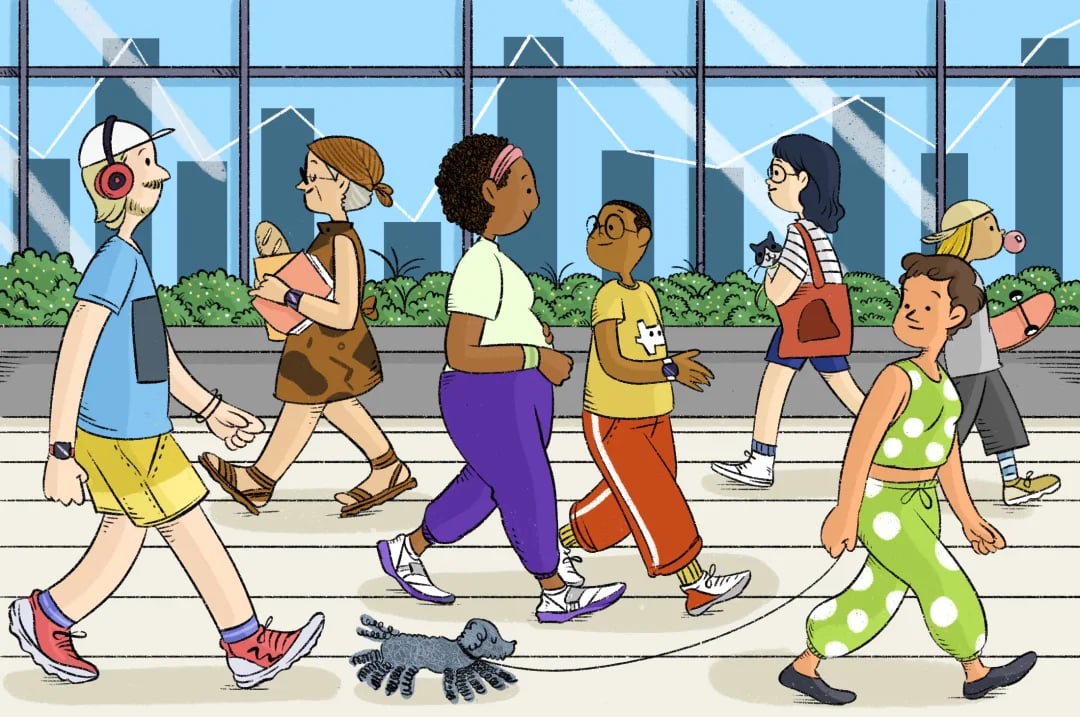 A diverse group of people walking along a city sidewalk.
