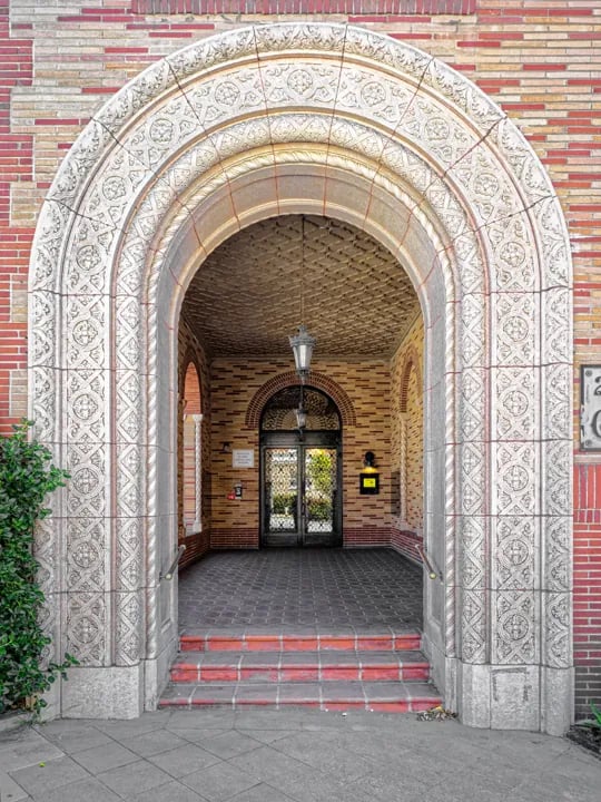Ornate stone archway entrance with intricate carved details in Pacific Heights San Francisco building