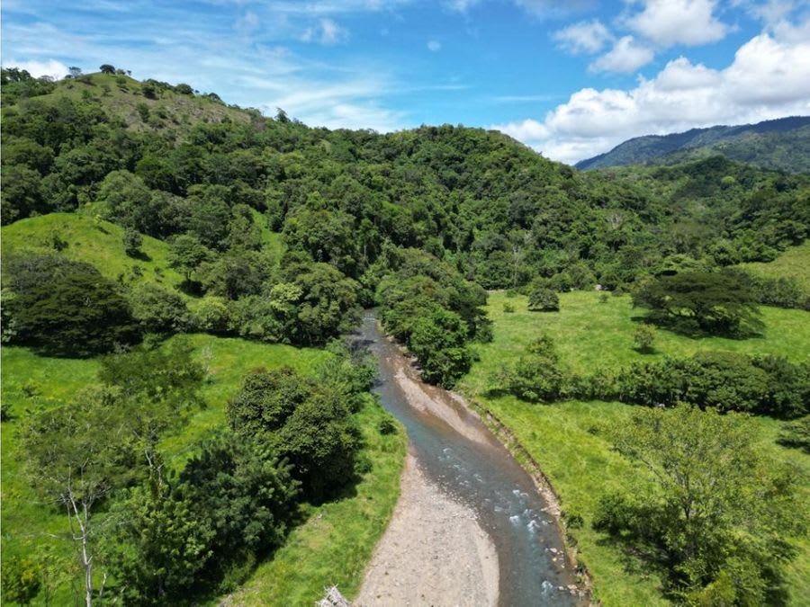 Farm with Mountain Range and River