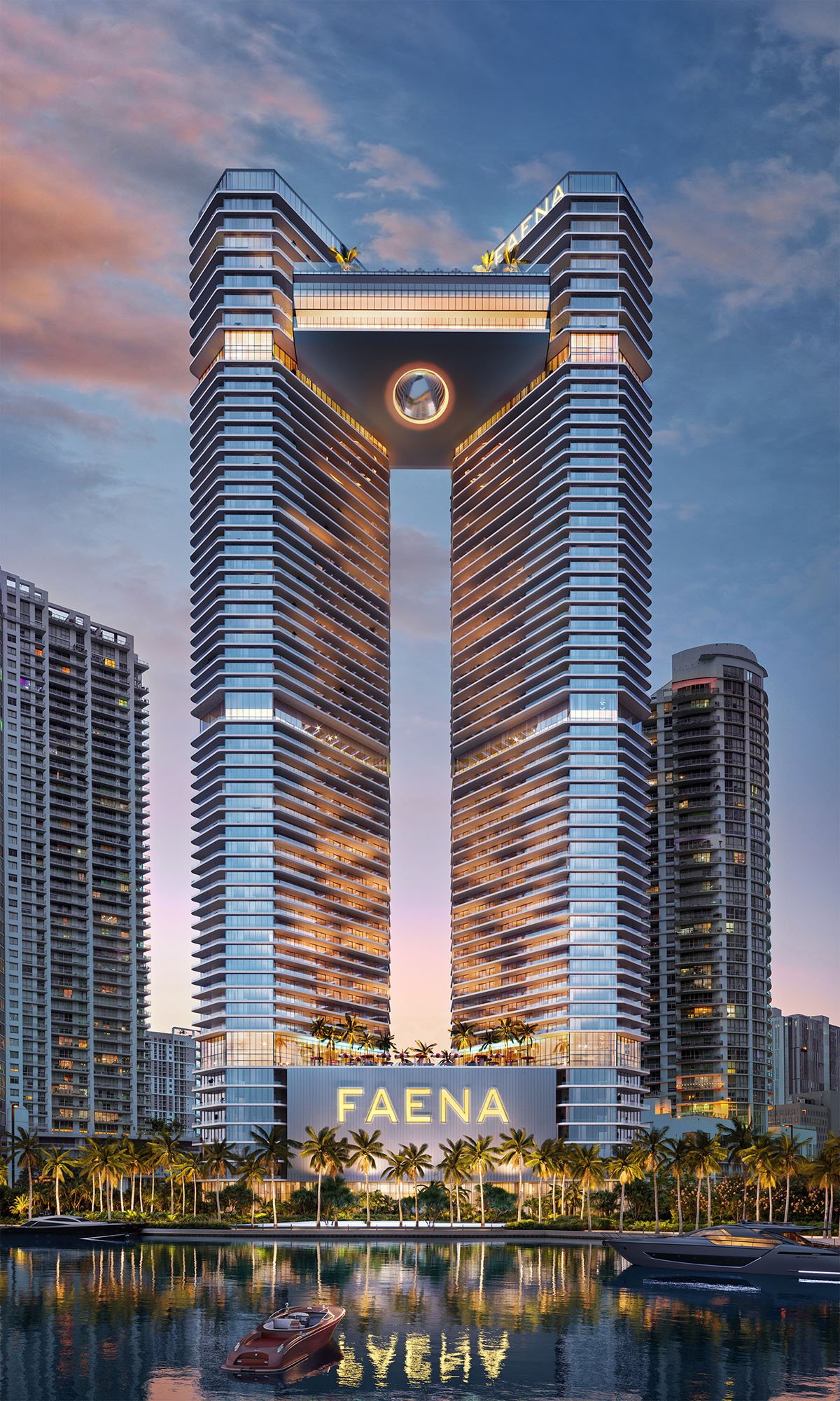 Faena Residences Miami twin towers joined by a bridge above the river at dusk.