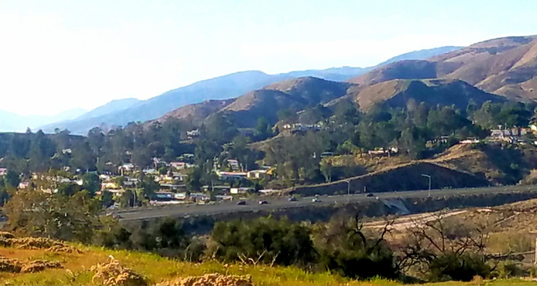 Hillside homes in East Highlands above the State Route 210 corridor, photographed in 2022