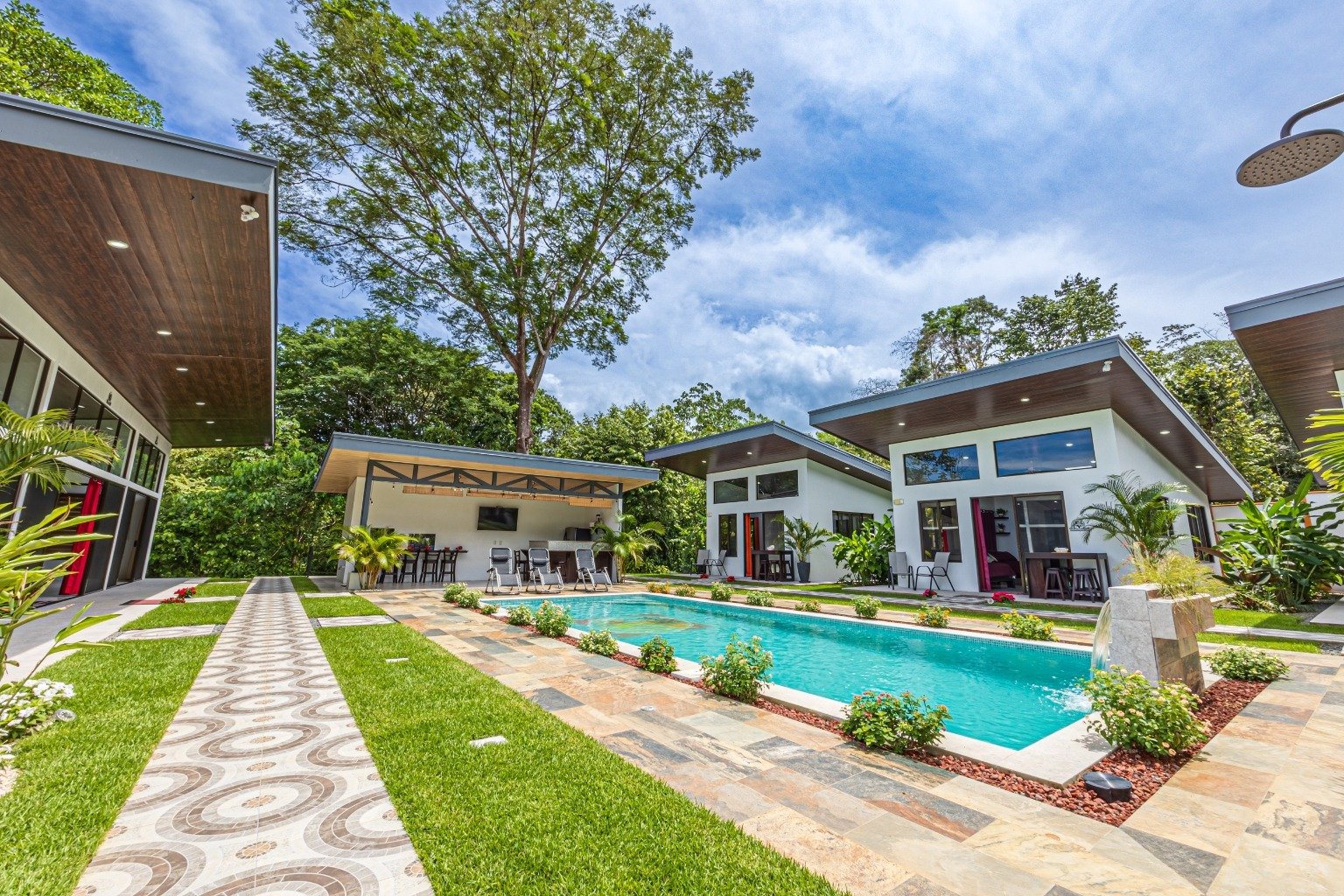 Incredible turnkey investment opportunity, 3 Rental villas, and a 2 Bedroom Home with a large pool.