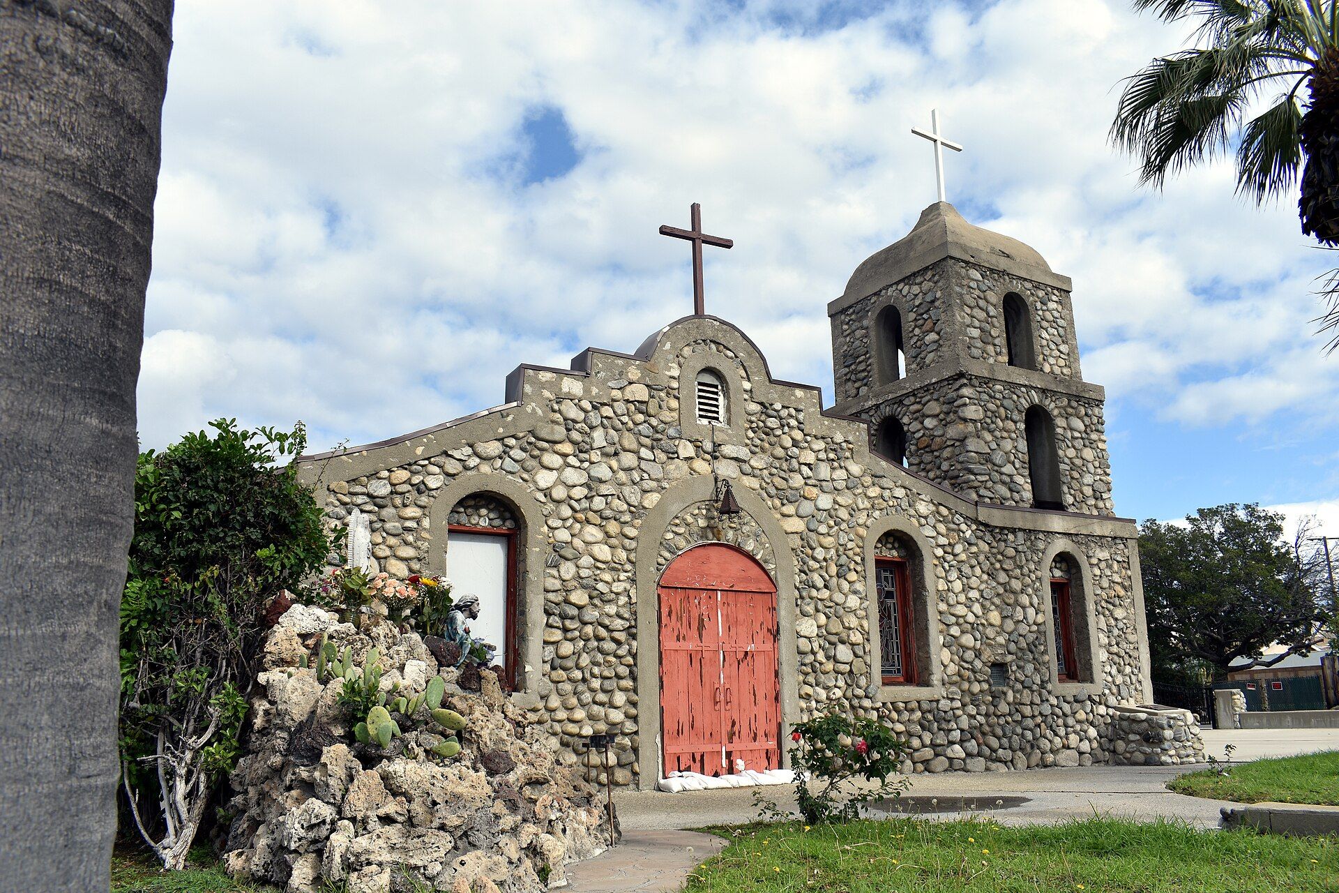 Stone facade of Our Lady of Guadalupe Mission Church on Arrow Highway in Irwindale