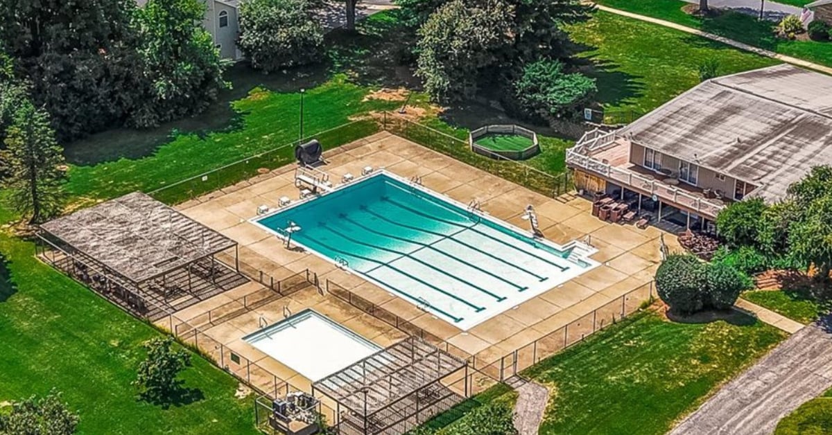 Aerial view of Orchard Brook subdivision community pool and clubhouse in Downers Grove IL