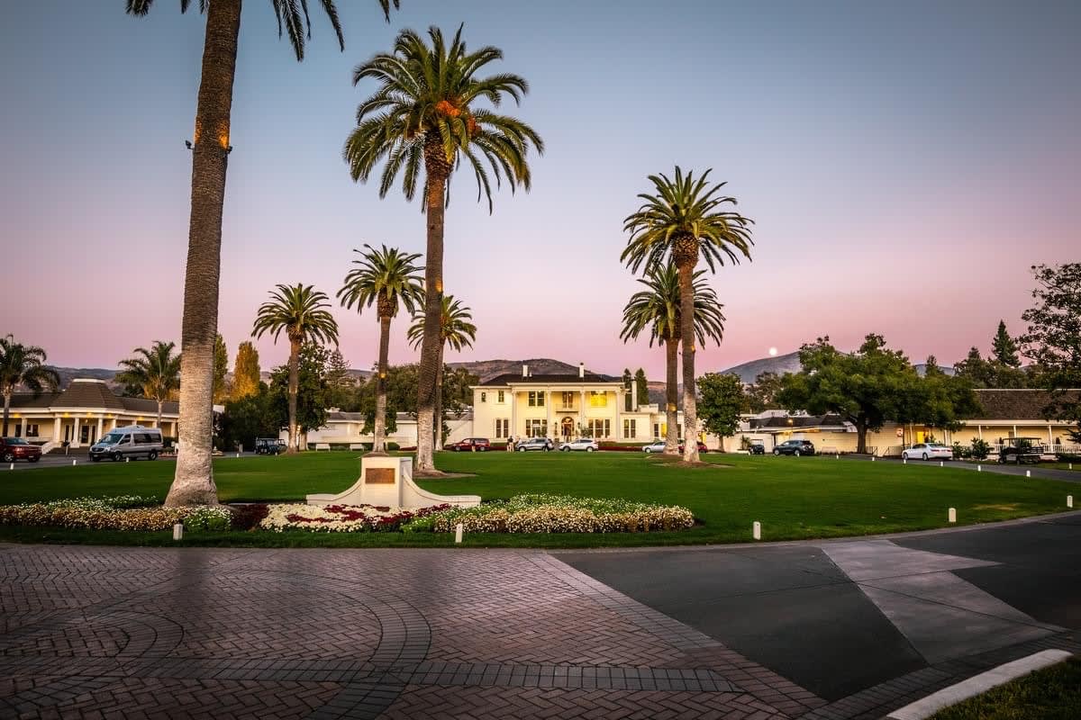 Silverado Country Club property entrance with palm trees and parked cars