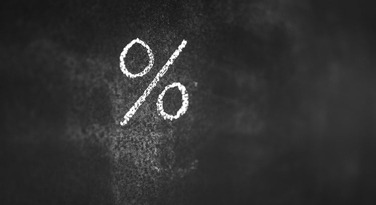 percentage symbol written in chalk on a blackboard