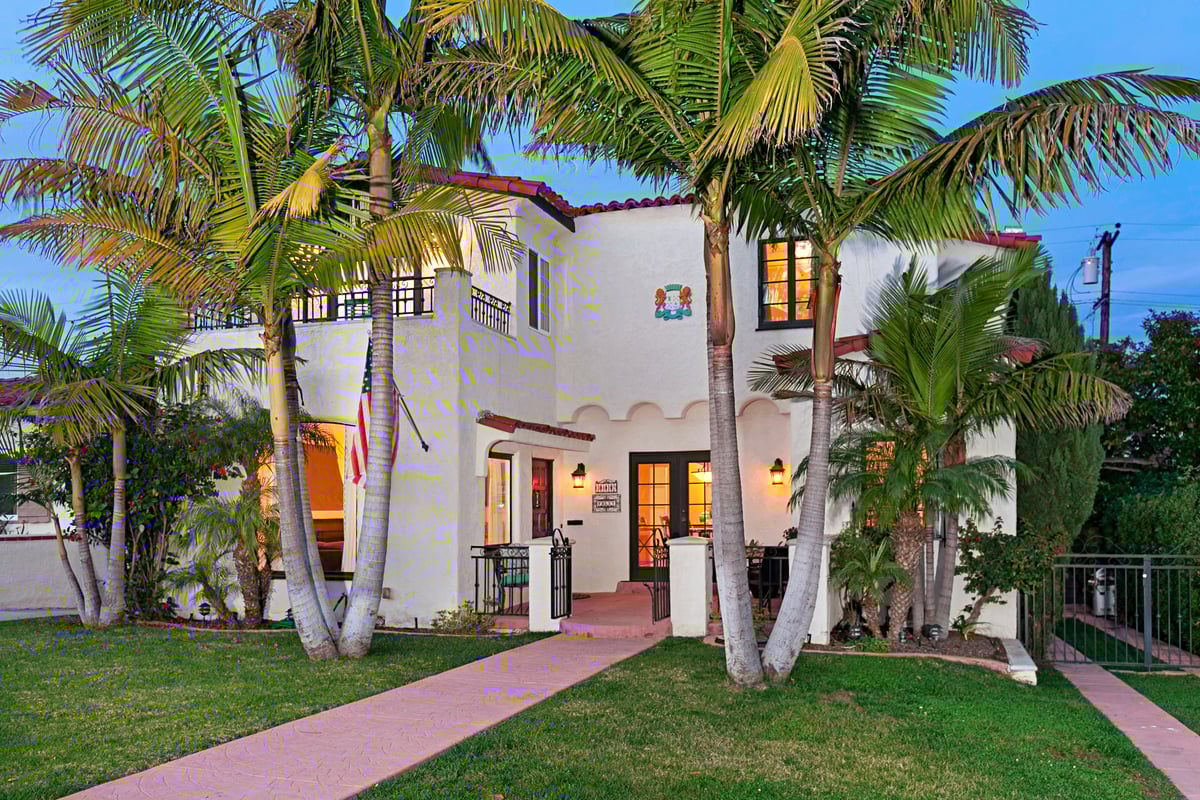 Charming Spanish-style home in Point Loma, San Diego, featuring traditional architecture, red tile roof, and lush gardens.