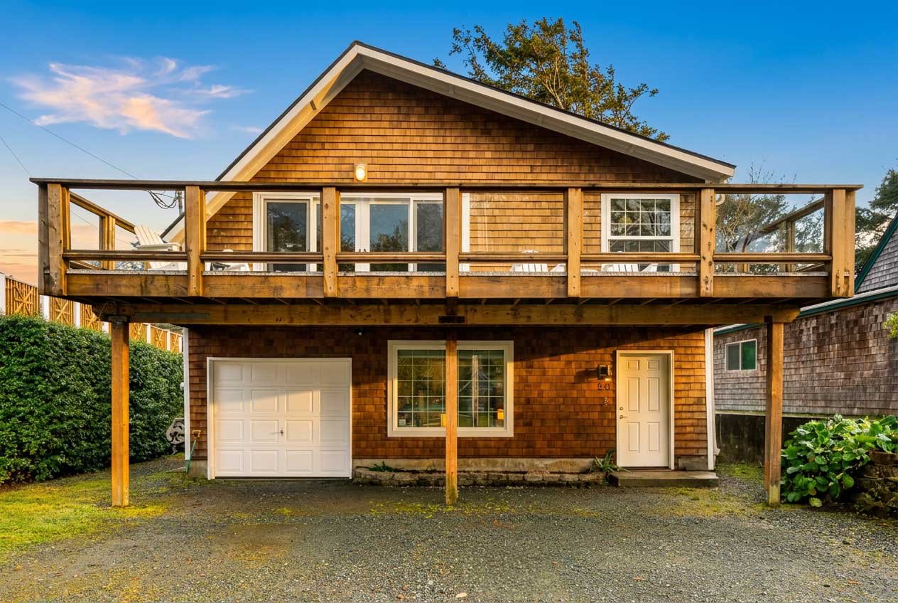 Sold beachside home at 58 Washington Ave in Manzanita, Oregon, with buyer representation by Erin Laskey of Home + Sea Realty, featuring partial ocean views, an upper deck, and beach access nearby.