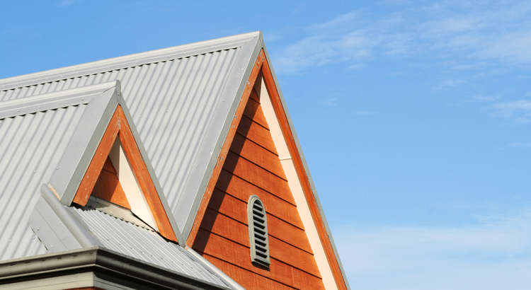 A metal roof featuring a window, showcasing a modern architectural design.