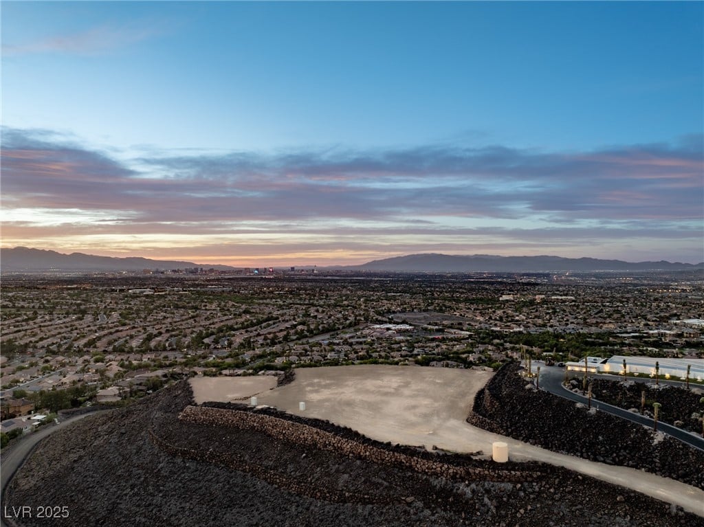 What makes MacDonald Highlands a better option for luxury buyers when comparing it to Summit Club and Ascaya?