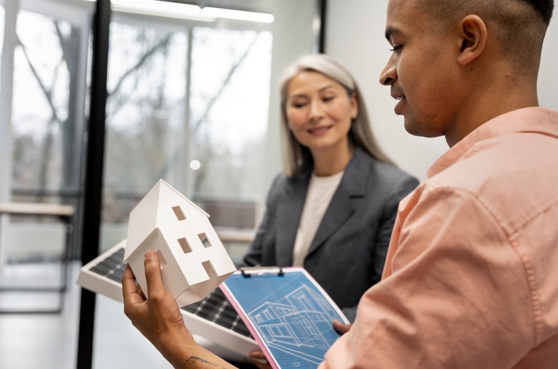 a man looking to a model house presented by realtor