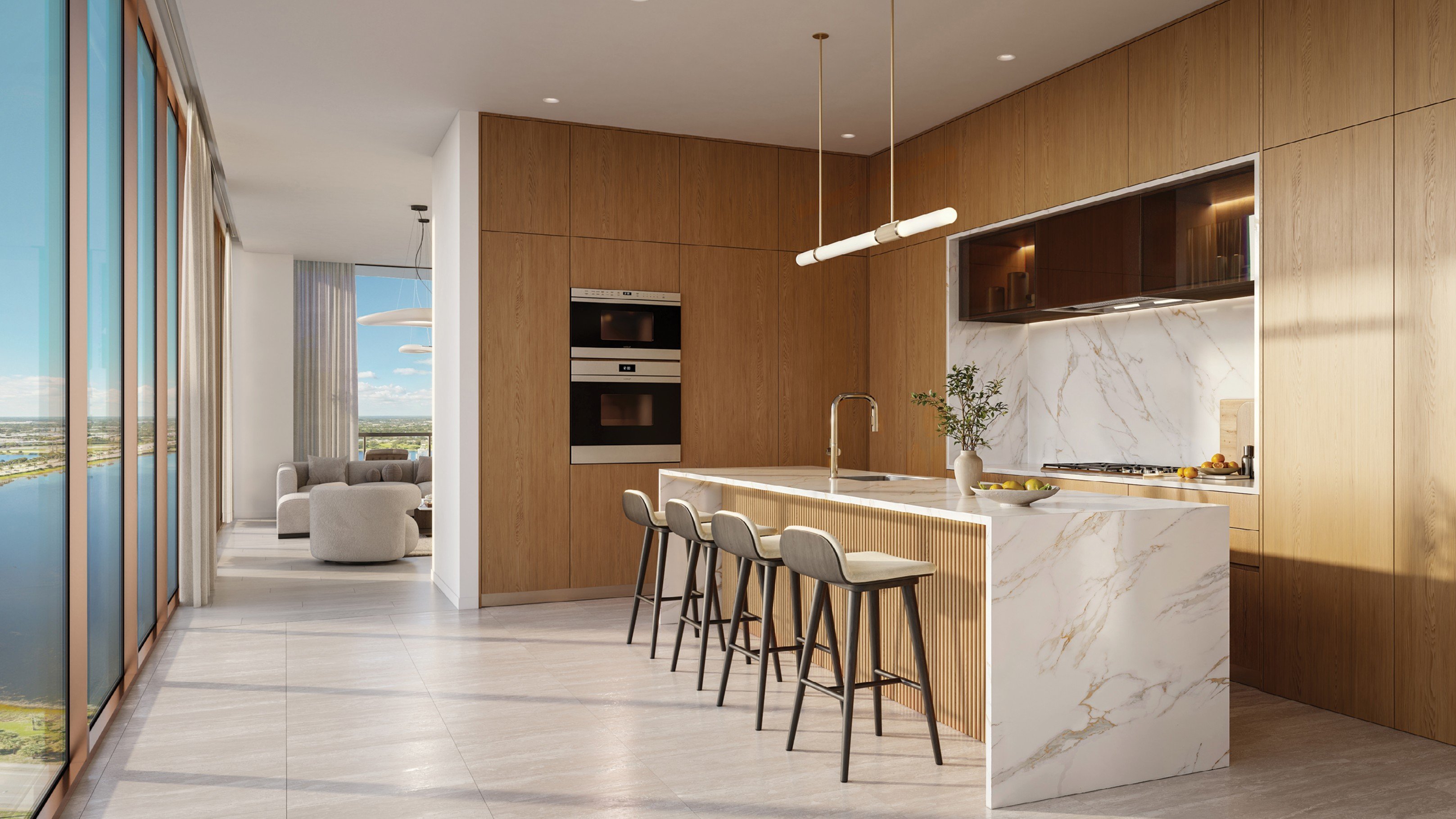 Rendering of a kitchen at The Berkeley with a marble island and bar seating beside floor-to-ceiling windows