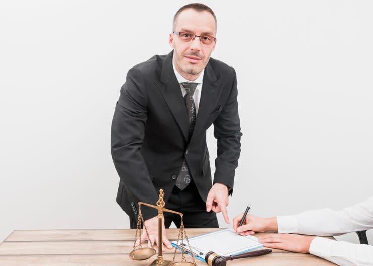 a realtor pointing to his client signed the document