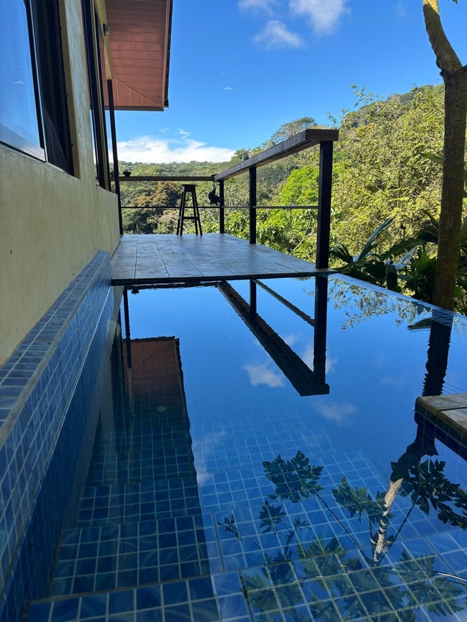 0.16 Acres – 4 Living Units, 7 Bedroom Riverfront Investment Package Near Dominical Beach With Owner Financing!!!