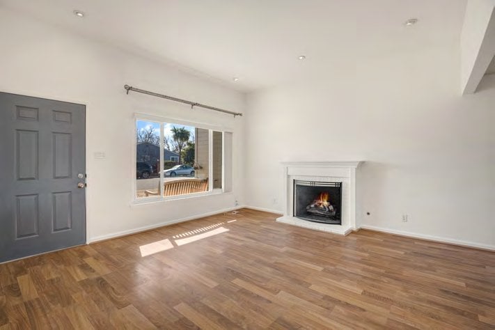 Living room with fireplace at 1401 and 1403 Cary Avenue, San Mateo