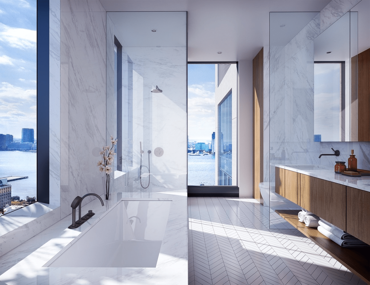 Marble bathroom with freestanding bathtub, glass shower, wood vanity, and river views.
