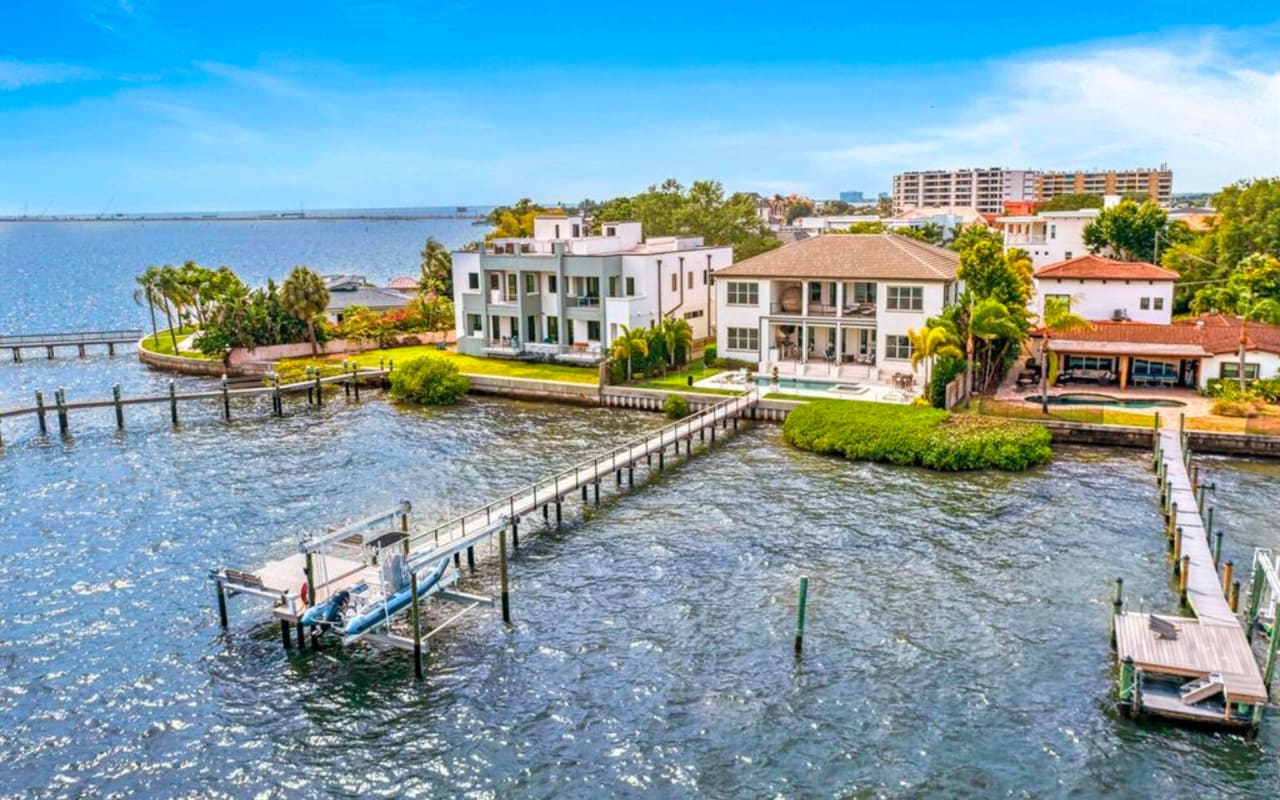 A collection of luxurious waterfront homes in Florida, each with a unique design and stunning views of the ocean.