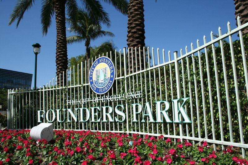 Founders Park in Aventura, Florida, surrounded by palm trees and vibrant scenery
