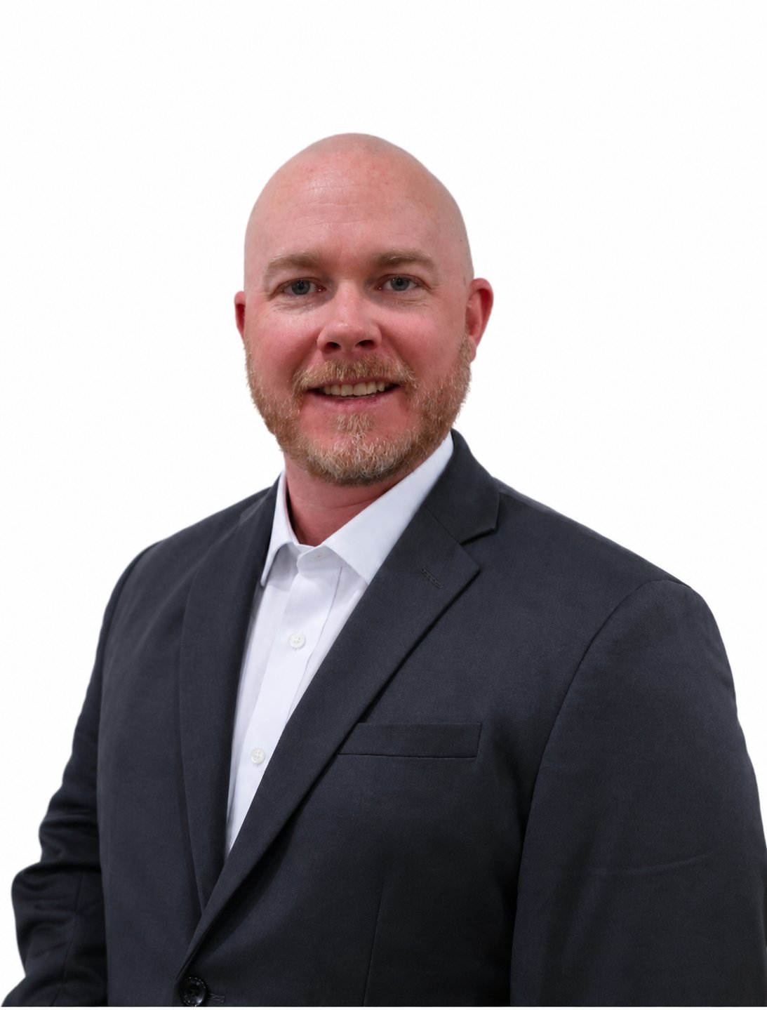 Austin Larsen, smiling bald man with a short beard wearing a dark suit.